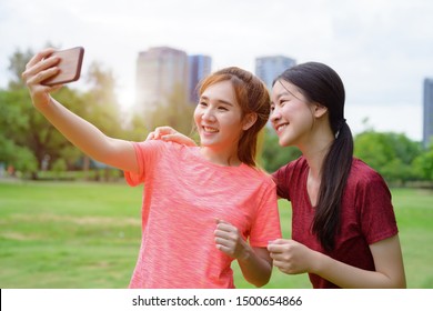 Young Asian Woman Jogging With Selfie Enjoyment 