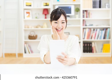 Young Asian Woman Looking Mirror In The Room