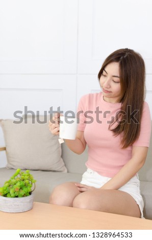 Young asian woman makes a cup of nice tea by tea bag for a tea break.