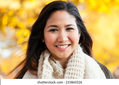 Young Asian Woman In Mid 20s Head And Shoulder Outdoor Autumn Headshot Portrait