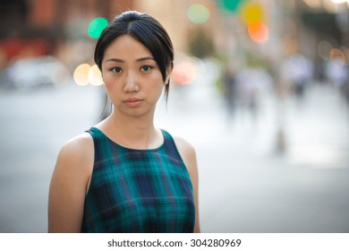 Young Asian Woman In New York City Street Serious Face Portrait