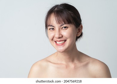 Young Asian Woman No Makeup And Smiling Confident With Freckle On Face. Concept Skin Care.