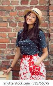 Young Asian Woman With Painting Outdoors. Mixed Race Student Girl On University College Campus Park Smiling Happy And Looking At Camera.