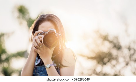 Young Asian Woman Photographer.