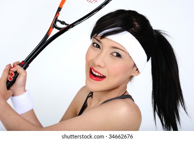 Young asian woman playing squash
