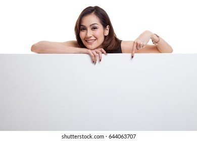Young Asian woman point to a  blank sign isolated on white background