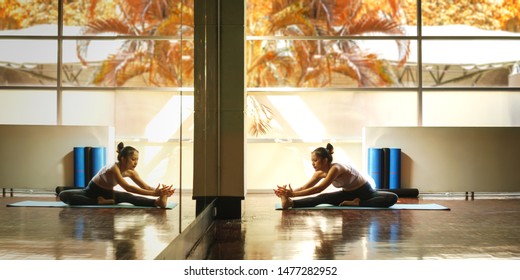 Young Asian Woman Prepare For Yoga Training By Streching Back And Legs