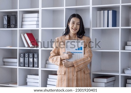 Young asian woman, professional entrepreneur standing in office clothing, smiling and looking confident, plan office space after working hours,	