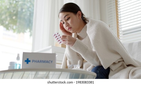 Young Asian Woman Receive Check Read Medication Capsule Drug Label Package Box Free First Aid Kit From Pharmacy Hospital Delivery Service Or Drugstore At Home In Online Telehealth Telemedicine.