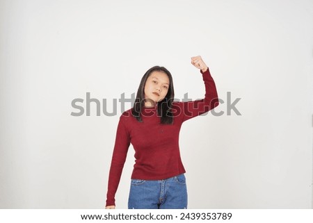 Young Asian woman in Red t-shirt Showing strong arms, emancipation of women concept isolated on white background