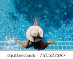 Young asian woman relaxing in swimming pool at spa resort.relaxing concept.