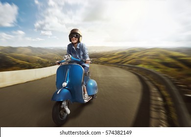 Young Asian Woman Riding Motor Scooter With Helmet Along Mountain Road