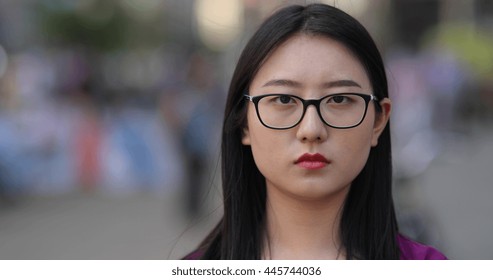 Young Asian Woman Serious Face Portrait