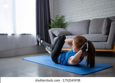 Young Asian Woman She Is Happy To Exercise In The House. Workout At Home.