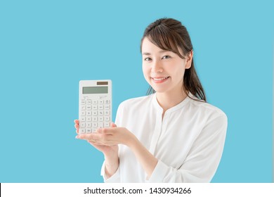 Young Asian Woman Showing A Calculator.