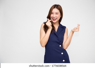 Young Asian Woman Showing Mini Heart Sign Isolated On White Background, Speading Love And Happiness Concept