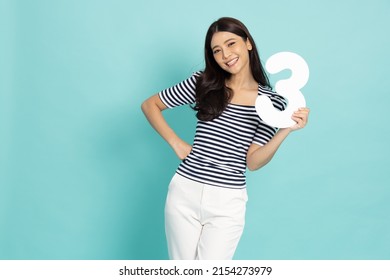 Young Asian woman showing number 3 or three isolated on green background - Shutterstock ID 2154273979