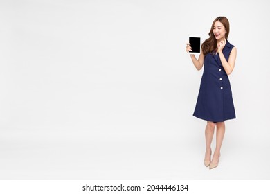 Young Asian Woman Showing Tablet On Hand Isolated On White Background, Full Body Composition