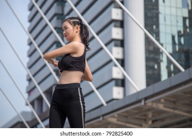 Young Asian Woman In Sportwear Have Exercise In The City