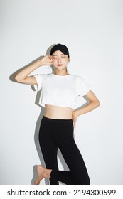 Young Asian Woman In Sporty Fashion