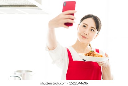 Young Asian Woman Taking Selfie With A Dish.