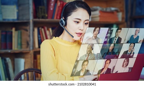 Young Asian Woman Taking Video Conference. Web Meeting. Blobal Communication Network.