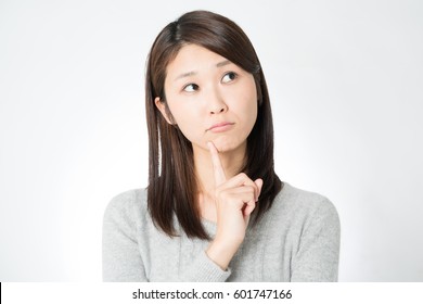 Young Asian Woman Thinking.