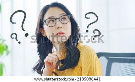 Young Asian woman thinking in the office.