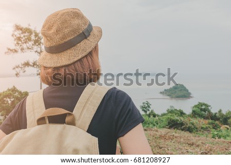 Young Asian woman traveling backpacker on Mountain 
