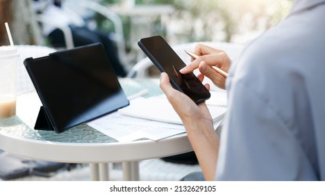 Young Asian Woman Using Personal Tablet For Freelance Job And Working Part Time, Online Education, Training, Blogging Or Online Shopping, Person Working With Online Technology In Modern World Concept.