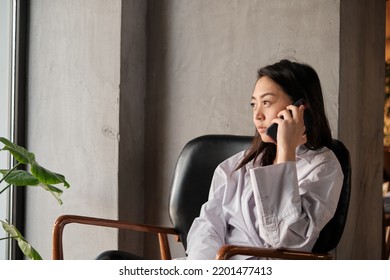 Young Asian Woman Using Smart Phone For Transfer Money, Business, Online Shopping, Financial, Internet Banking In Coffee Shop.