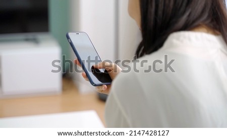 young asian woman using smartphone