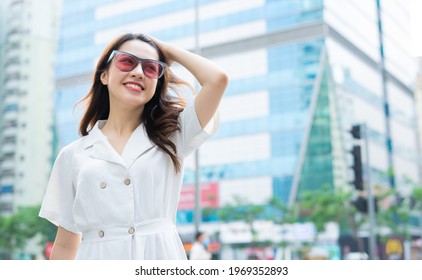 Young Asian Woman Walking On The Street