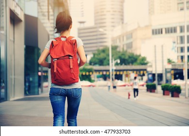 Young Asian Woman Walking On City Street