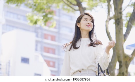 Young Asian Woman Walking Outdoors