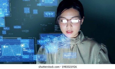 Young asian woman watching hologram screens. Business technology.