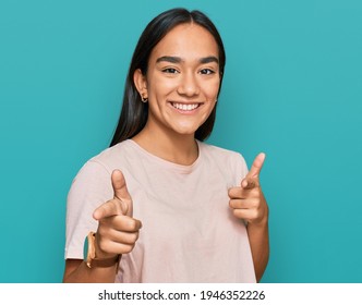 Young Asian Woman Wearing Casual Clothes Pointing Fingers To Camera With Happy And Funny Face. Good Energy And Vibes. 