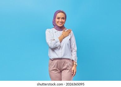 Young Asian Woman Wearing Headscarf Gives Greeting Hands At With Big Smile On Her Face