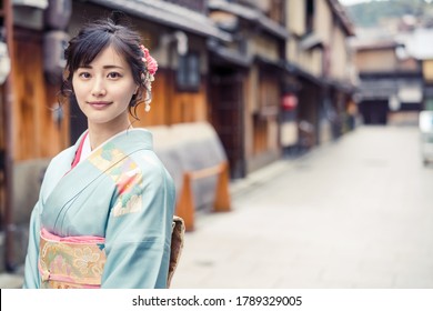 Young asian woman wearing kimono. Japanese traditional clothes.
