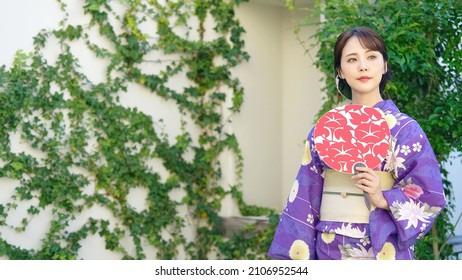 Young Asian woman wearing Kimono. Japanese traditional clothes.