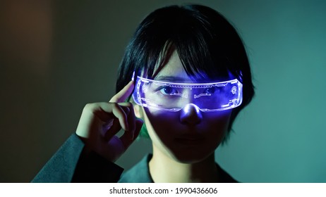 Young Asian Woman Wearing Smart Glasses. Wearable Device.