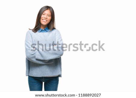 Young asian woman wearing winter sweater over isolated background happy face smiling with crossed arms looking at the camera. Positive person.