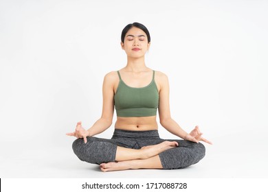 Young Asian Woman Yoga Meditating On White Background