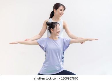 Young Asian Women Doing Yoga. Yoga Instructor.