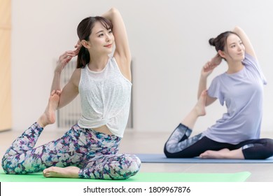 Young Asian Women Doing Yoga. Yoga Instructor.