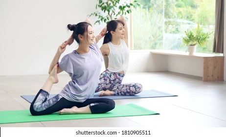 Young Asian Women Doing Yoga. Yoga Instructor.