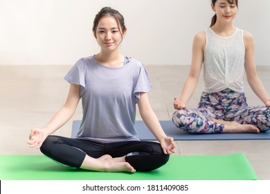 Young Asian Women Doing Yoga. Yoga Instructor.