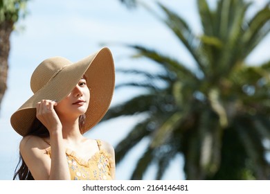 Young Asian women enjoying the resort - Powered by Shutterstock