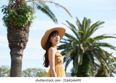 Young Asian Women Enjoying The Resort