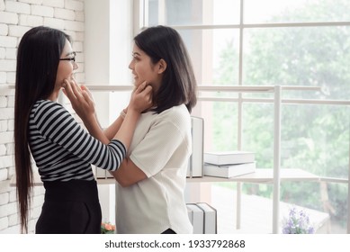 Young asian women lesbian lgbt couple with happy moment. LGBT lesbian couple together indoors concept. - Shutterstock ID 1933792868